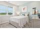 Cozy bedroom features a large window and soft colors at 30 Benfield Dr, Whiteland, IN 46184