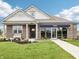 Charming model home featuring a brick facade, manicured lawn, and inviting entrance at 30 Benfield Dr, Whiteland, IN 46184