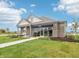 Beautiful model home with lush green lawn, blue skies, and inviting walkway at 30 Benfield Dr, Whiteland, IN 46184