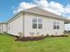 Angled exterior view of home featuring tidy landscaping and new green lawn at 30 Benfield Dr, Whiteland, IN 46184