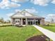 Attractive home with landscaped front yard and clear blue sky above at 30 Benfield Dr, Whiteland, IN 46184