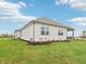 A side angle exterior of a new build, featuring neat landscaping and a well-maintained lawn at 30 Benfield Dr, Whiteland, IN 46184