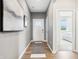 Bright and open hallway with wood floors, modern decor, and ample natural light at 30 Benfield Dr, Whiteland, IN 46184