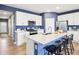 Modern kitchen with white cabinets, stainless steel appliances, and a center island with seating at 30 Benfield Dr, Whiteland, IN 46184