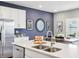 Kitchen featuring white cabinets, a kitchen island, and stainless steel appliances at 30 Benfield Dr, Whiteland, IN 46184