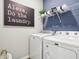 The laundry room features new Maytag appliances at 30 Benfield Dr, Whiteland, IN 46184