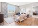 Inviting living room with large windows, modern furniture, and stylish blue patterned curtains at 30 Benfield Dr, Whiteland, IN 46184