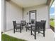 Relaxing outdoor patio seating area overlooking the spacious yard at 30 Benfield Dr, Whiteland, IN 46184
