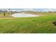 Scenic view of a backyard pond and fountain, providing a relaxing outdoor atmosphere at 30 Benfield Dr, Whiteland, IN 46184