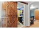 Bathroom entrance with sliding barn door, vanity, mirror, and shelves for storage at 303 W 7Th St, Lapel, IN 46051