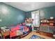 Charming bedroom features wood floors, ample storage and cheerful decor at 303 W 7Th St, Lapel, IN 46051