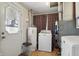 Convenient laundry room with washer, dryer, water heater and access to the outside at 303 W 7Th St, Lapel, IN 46051
