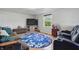 Inviting living room with a flat screen TV, cozy furniture, and a round area rug at 303 W 7Th St, Lapel, IN 46051