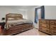 Spacious main bedroom with wood-look flooring, natural light and dark wood accents at 303 W 7Th St, Lapel, IN 46051