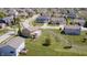 An aerial view of a suburban neighborhood with lush lawns and mature trees surrounding the homes at 3147 Winings Ln, Carmel, IN 46074