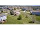 A nice two story home with a well maintained lawn and a nice deck with pergola in back at 3147 Winings Ln, Carmel, IN 46074