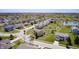 An aerial view of a suburban neighborhood with lush lawns and mature trees surrounding the homes at 3147 Winings Ln, Carmel, IN 46074