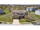 Aerial view of a beautiful suburban home with a well-maintained lawn, surrounded by mature trees and a peaceful neighborhood at 3147 Winings Ln, Carmel, IN 46074