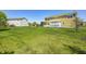 The expansive backyard includes a manicured lawn and a charming pergola-covered deck, ideal for relaxing and entertaining at 3147 Winings Ln, Carmel, IN 46074