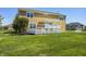 Home backyard featuring a well-maintained lawn and a charming deck with a pergola, perfect for outdoor gatherings at 3147 Winings Ln, Carmel, IN 46074