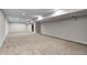 Spacious basement with neutral carpet and paint, and recessed lighting provides a blank canvas to create your dream space at 3147 Winings Ln, Carmel, IN 46074