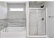 Bathroom featuring a soaking tub, tiled backsplash and glass enclosed shower at 3147 Winings Ln, Carmel, IN 46074