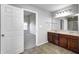 Bathroom with double vanity, tile flooring, and access to the bedroom at 3147 Winings Ln, Carmel, IN 46074