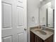Compact bathroom featuring a vanity and a mirrored cabinet at 3147 Winings Ln, Carmel, IN 46074