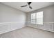 Cozy bedroom featuring neutral carpet, a ceiling fan, and natural light at 3147 Winings Ln, Carmel, IN 46074