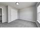 A cozy bedroom provides a closet, neutral walls, soft carpet and a window at 3147 Winings Ln, Carmel, IN 46074