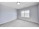 A cozy bedroom offers neutral walls, soft carpet and a window for lots of natural light at 3147 Winings Ln, Carmel, IN 46074