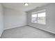 A cozy bedroom offers neutral walls, soft carpet and a window with a beautiful view at 3147 Winings Ln, Carmel, IN 46074