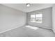 A cozy bedroom offers neutral walls, soft carpet and a window with a beautiful view at 3147 Winings Ln, Carmel, IN 46074