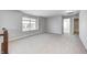 Bonus room with gray walls, carpet flooring, and a large window for natural light at 3147 Winings Ln, Carmel, IN 46074