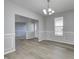 Elegant dining room boasting natural light and stylish wainscoting at 3147 Winings Ln, Carmel, IN 46074