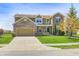 Beautiful two-story home with brick and siding exterior, well-manicured lawn, and a long driveway, showcasing suburban charm at 3147 Winings Ln, Carmel, IN 46074