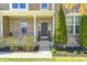 Charming brick home featuring a welcoming front porch with manicured landscaping, creating an inviting curb appeal at 3147 Winings Ln, Carmel, IN 46074