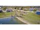 The neighborhood pond, featuring a nice walking path and a playground in the background at 3147 Winings Ln, Carmel, IN 46074