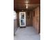 Back porch featuring brick walls, a screen door, and access to the backyard at 3208 Brookside Pkwy N Dr, Indianapolis, IN 46218