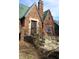 Picture of a cozy red brick home with a green roof and an ornate iron front door at 3208 Brookside Pkwy N Dr, Indianapolis, IN 46218