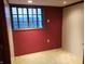 Image of a room with a large window, carpet, and a red and gray wall at 3208 Brookside Pkwy N Dr, Indianapolis, IN 46218