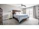 Primary bedroom featuring a sliding glass door, ceiling fan and neutral decor at 354 E Arch St, Indianapolis, IN 46202