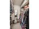 Well-organized walk-in closet featuring ample shelving, hanging space, and a full-length mirror, maximizing storage and convenience at 354 E Arch St, Indianapolis, IN 46202