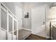 Entryway with white doors, carpeted stairs, and hardwood flooring at 354 E Arch St, Indianapolis, IN 46202