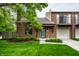 Charming brick townhome featuring well-maintained landscaping and inviting curb appeal at 354 E Arch St, Indianapolis, IN 46202