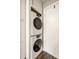 The in-unit stacked washer and dryer are conveniently located within the kitchen space at 354 E Arch St, Indianapolis, IN 46202