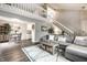 Open-concept living room with a cozy seating area and second story overlook at 354 E Arch St, Indianapolis, IN 46202