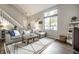 Spacious living room with large window and comfortable sectional sofa at 354 E Arch St, Indianapolis, IN 46202