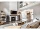 Open-concept living room with fireplace, TV, and dining area at 354 E Arch St, Indianapolis, IN 46202