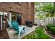 Private patio featuring comfortable seating, a grill, and access to a well-maintained lawn, creating an inviting outdoor space at 354 E Arch St, Indianapolis, IN 46202